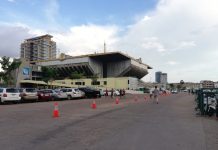 A small group of people job around Olympic Stadium grounds on the first day of its reopening, on July 28. (Nong Maichakreya)
